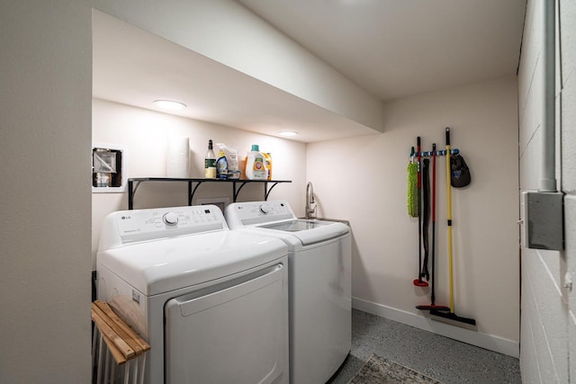 laundry area with independent washer and dryer