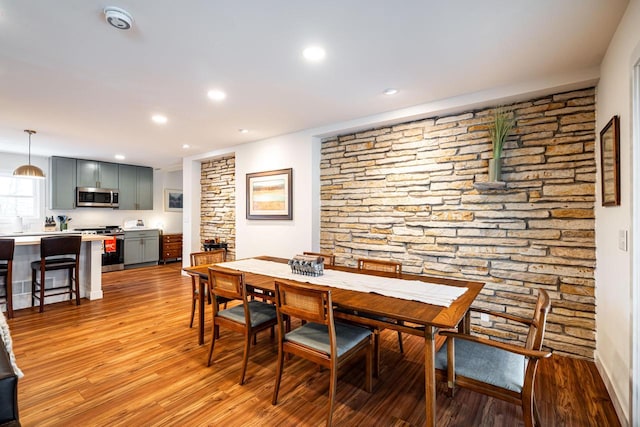 dining space with light wood-type flooring