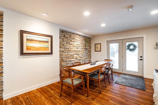 dining area featuring dark wood-type flooring