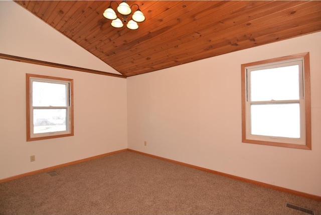 empty room with wood ceiling, vaulted ceiling, carpet, and a notable chandelier