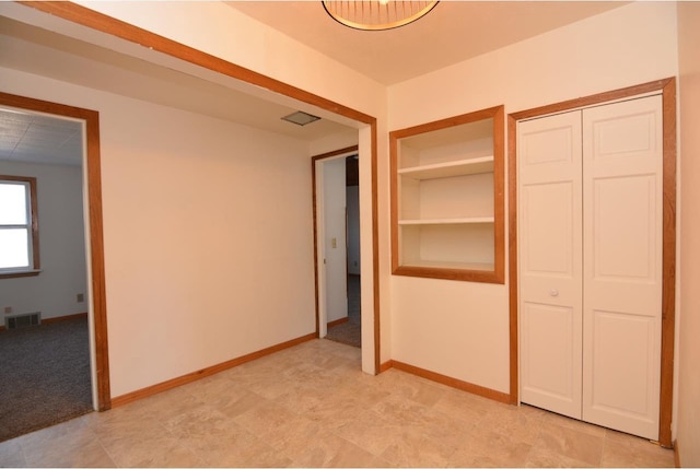 unfurnished bedroom featuring a closet