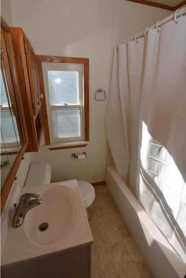 full bathroom with toilet, vanity, and shower / bath combination with curtain