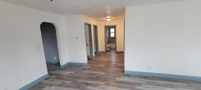 empty room featuring dark hardwood / wood-style flooring