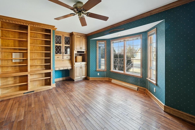 unfurnished living room featuring crown molding, a baseboard radiator, dark hardwood / wood-style floors, and ceiling fan