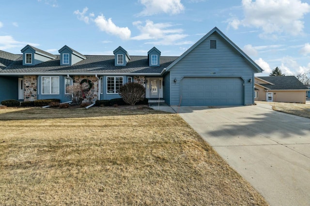 view of front of home featuring a garage and a front yard