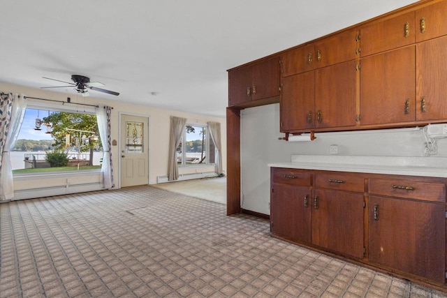 kitchen featuring ceiling fan and a baseboard radiator