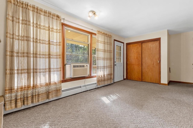 interior space featuring baseboard heating, carpet floors, and cooling unit