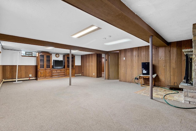 basement with a baseboard radiator and carpet flooring