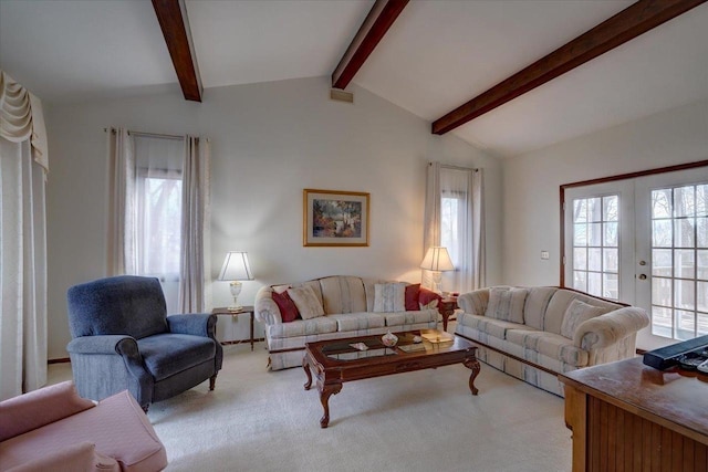 living room with french doors, light colored carpet, and vaulted ceiling with beams