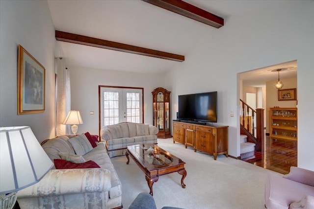 carpeted living room featuring vaulted ceiling with beams and french doors