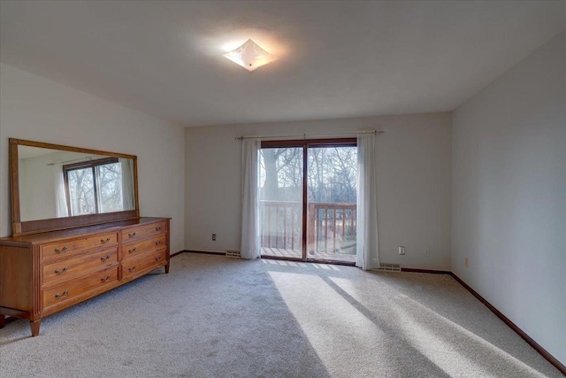 empty room featuring light colored carpet