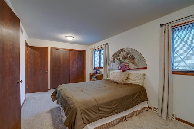 carpeted bedroom featuring a closet