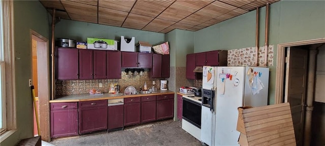 kitchen with sink, white appliances, and tasteful backsplash