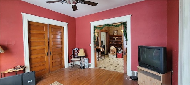 foyer entrance with hardwood / wood-style flooring and ceiling fan