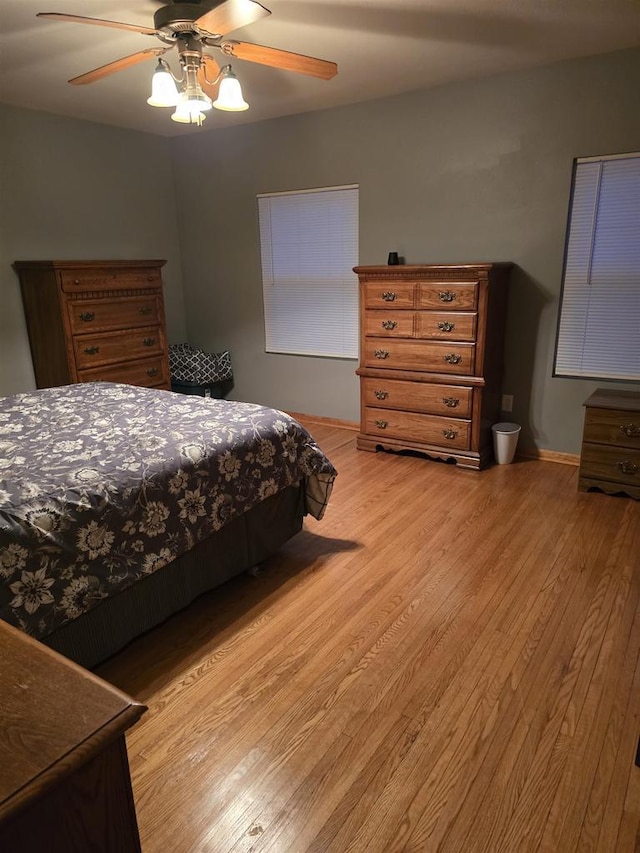 bedroom featuring light hardwood / wood-style floors and ceiling fan