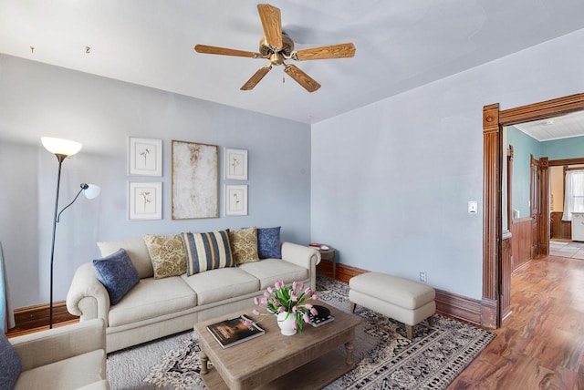 living room featuring hardwood / wood-style flooring and ceiling fan