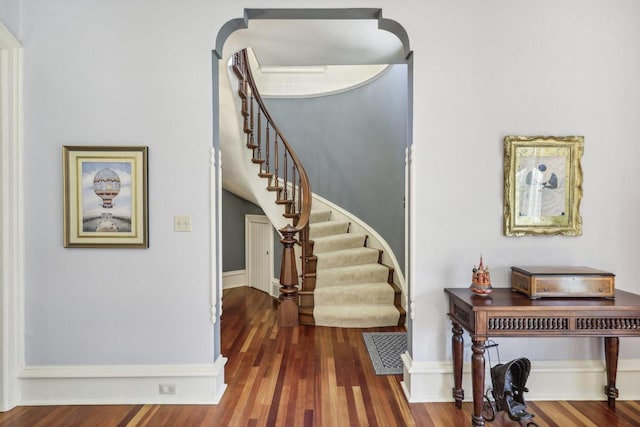 entryway with dark hardwood / wood-style floors