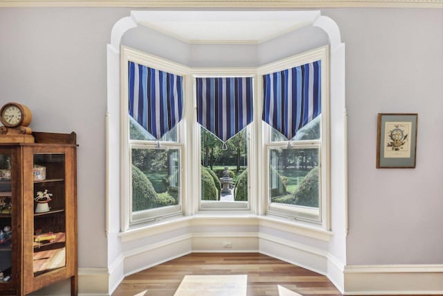 details featuring hardwood / wood-style flooring and crown molding