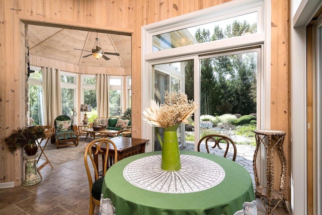 sunroom / solarium featuring wood ceiling, ceiling fan, a wealth of natural light, and vaulted ceiling