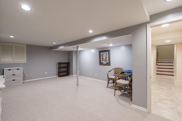 sitting room featuring light colored carpet