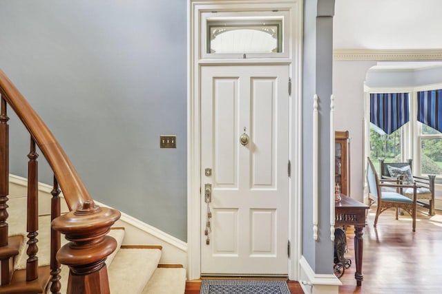 foyer featuring hardwood / wood-style floors and ornamental molding