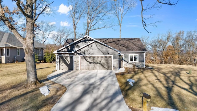 view of front facade featuring a garage and a front lawn