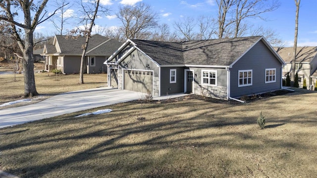 single story home with a garage and a front yard