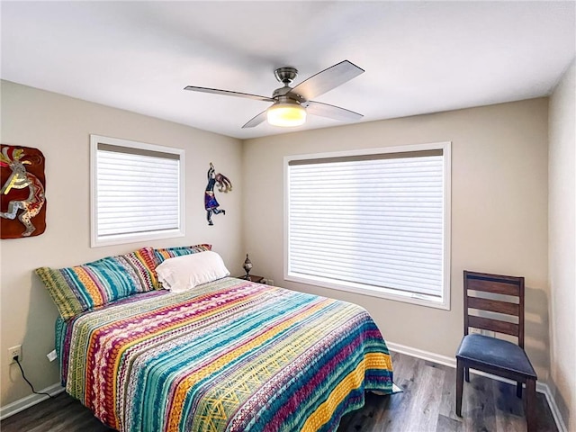 bedroom featuring dark hardwood / wood-style flooring and ceiling fan