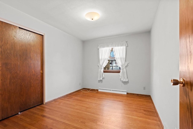 spare room with hardwood / wood-style flooring