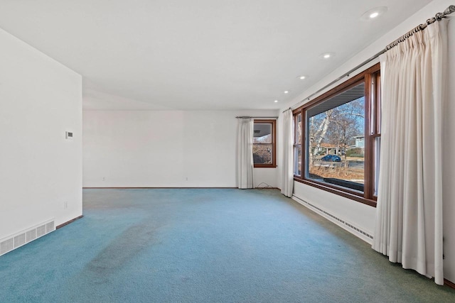 empty room featuring dark colored carpet