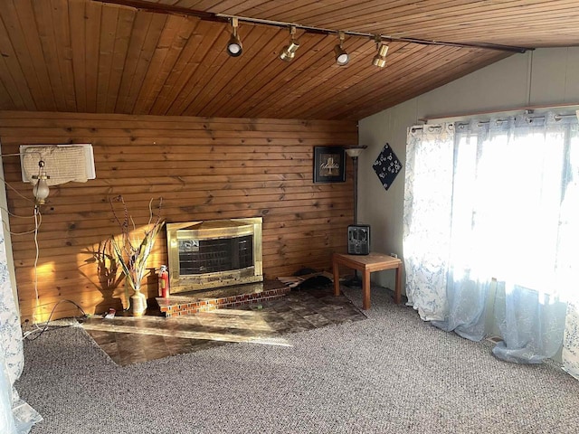 unfurnished living room featuring carpet floors, wooden ceiling, wood walls, and vaulted ceiling