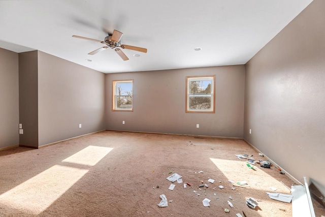 spare room with ceiling fan