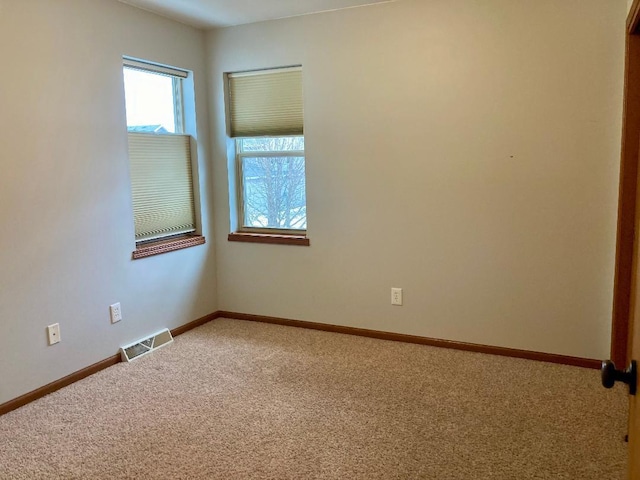 empty room featuring carpet floors