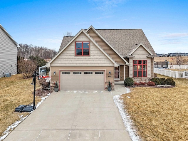 view of front of house featuring a garage and a front yard