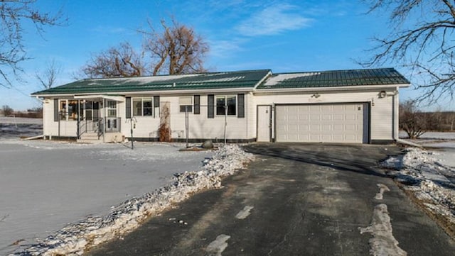 ranch-style home with a garage