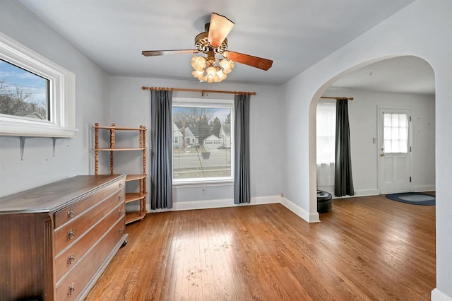 interior space with light wood-type flooring and ceiling fan