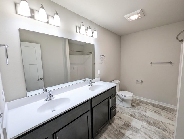 6839 Belle Fontaine Blvd, Middleton, WI 53562 - full bathroom with double vanity, toilet, marble look tile flooring, and baseboards