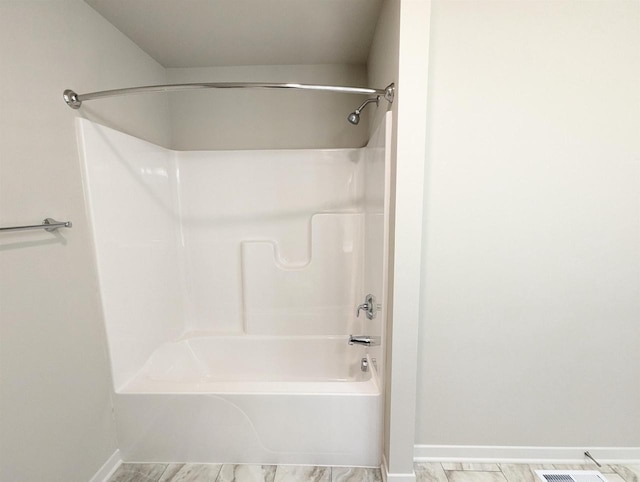 6839 Belle Fontaine Blvd, Middleton, WI 53562 - bathroom featuring baseboards and shower / bath combination