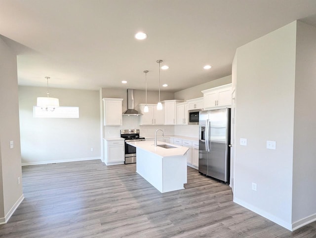 6839 Belle Fontaine Blvd, Middleton, WI 53562 - kitchen with stainless steel appliances, wall chimney exhaust hood, a sink, light countertops, and light wood-style floors