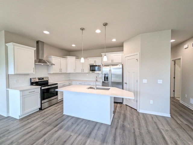 6839 Belle Fontaine Blvd, Middleton, WI 53562 - kitchen featuring stainless steel appliances, wall chimney exhaust hood, a sink, light wood finished floors, and light countertops