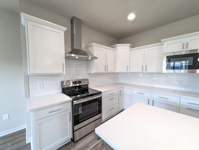 6839 Belle Fontaine Blvd, Middleton, WI 53562 - kitchen featuring appliances with stainless steel finishes, wall chimney exhaust hood, wood finished floors, white cabinets, and light countertops