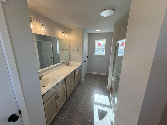 N118W1479 Mistletoe Rd, Germantown, WI 53022 - bathroom with double vanity, tile patterned floors, an enclosed shower, and baseboards