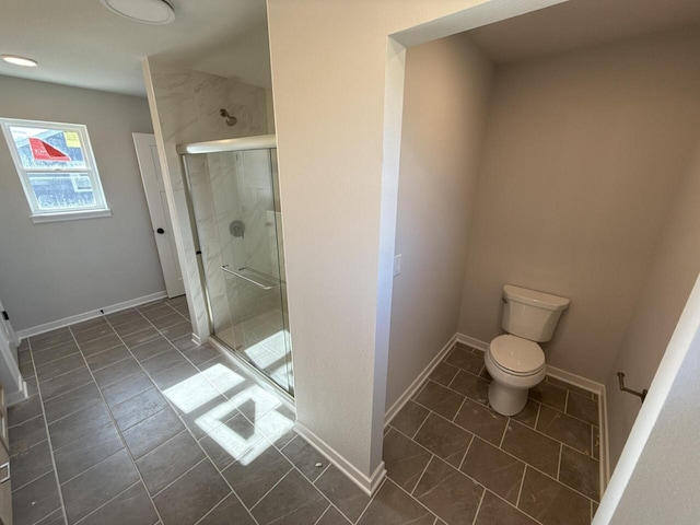 N118W1479 Mistletoe Rd, Germantown, WI 53022 - bathroom with a shower stall, toilet, and baseboards