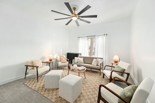 carpeted living room featuring radiator and ceiling fan