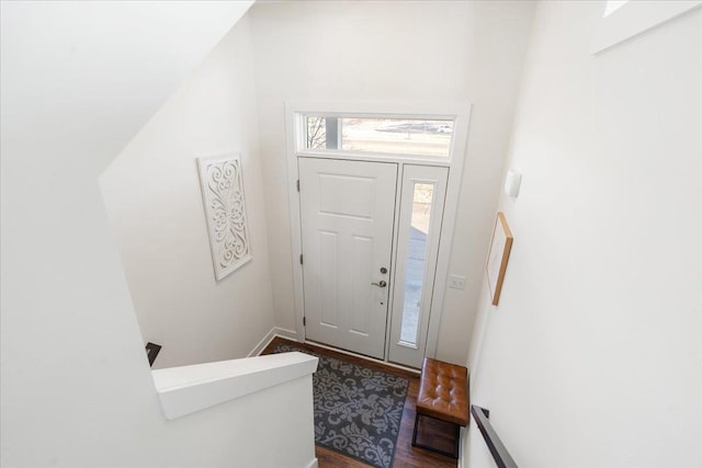 foyer with dark hardwood / wood-style floors