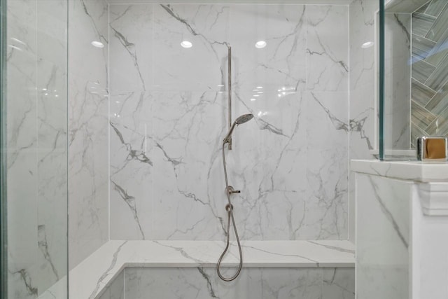 bathroom with tiled shower