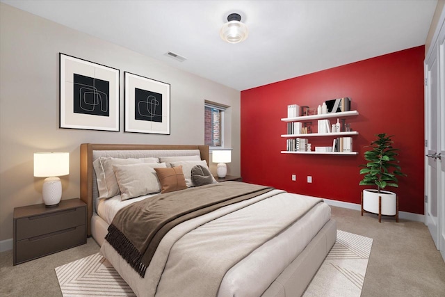 bedroom with light colored carpet