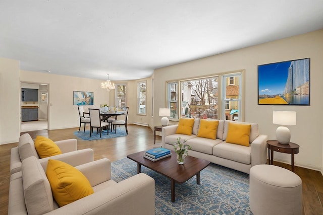 living room featuring hardwood / wood-style flooring and a chandelier