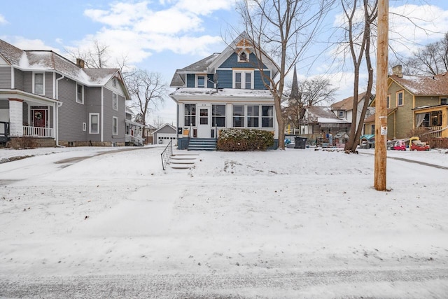 view of front of house with a sunroom