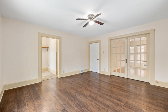 spare room with dark wood-type flooring, ceiling fan, and french doors